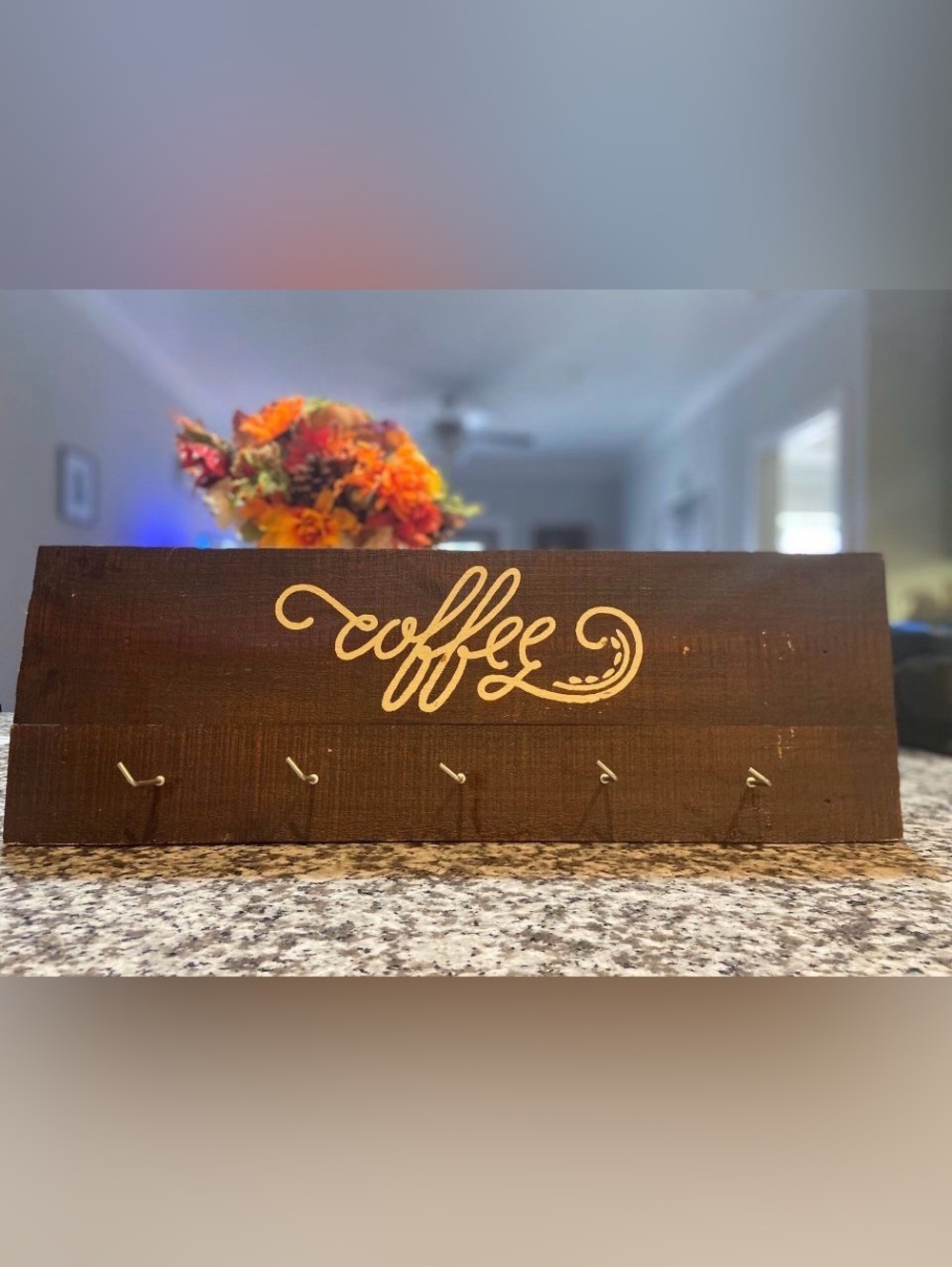 Kirkland’s Wooden Coffee Wall Hook Rack holds up to 5 cups.